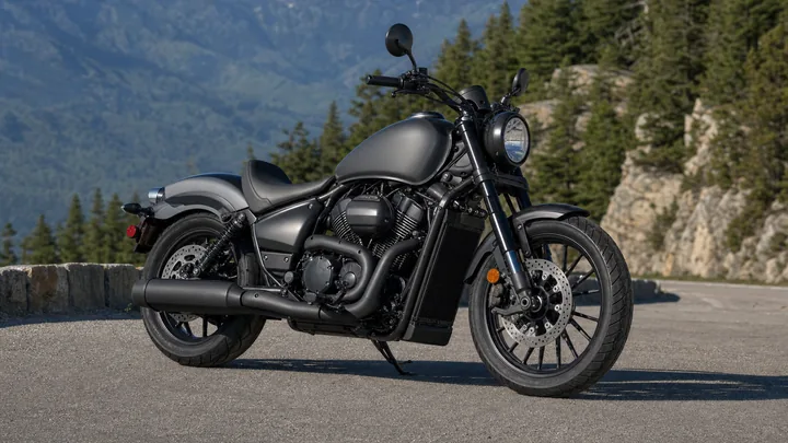 Graphite cruiser motorcycle on a mountain road